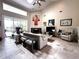 Bright living room featuring tile floors, high ceilings, a fireplace, and a sliding glass door to the outdoor space at 8935 Jonathan Manor Dr, Orlando, FL 32819