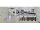 Bright kitchen featuring white cabinets, stainless steel appliances, and a breakfast bar with seating at 981 Victoria Ter, Altamonte Springs, FL 32701