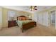 Spacious main bedroom with large windows allowing lots of natural light with beautiful yellow walls at 981 Victoria Ter, Altamonte Springs, FL 32701