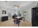 Cozy home office with lots of natural light, computer, desk, and chair with wall to wall neutral colored carpet at 981 Victoria Ter, Altamonte Springs, FL 32701