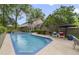 Inviting backyard pool with patio seating and lush landscaping, perfect for outdoor relaxation and entertaining at 981 Victoria Ter, Altamonte Springs, FL 32701