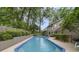 Inviting pool surrounded by greenery and tasteful landscaping, offering a private backyard oasis for relaxation and enjoyment at 981 Victoria Ter, Altamonte Springs, FL 32701