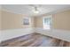 Bright bedroom features wood floors and classic chair rail moulding at 1013 Glensprings Ave, Winter Garden, FL 34787