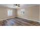Cozy bedroom with wood floors, neutral walls, and plenty of natural light at 1013 Glensprings Ave, Winter Garden, FL 34787