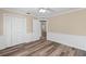 Bedroom showcasing wood floors and an interior doorway at 1013 Glensprings Ave, Winter Garden, FL 34787