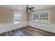 This bedroom features beautiful new floors, natural light and a ceiling fan at 1013 Glensprings Ave, Winter Garden, FL 34787