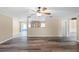 Open-concept living room with access to the kitchen and backyard at 1013 Glensprings Ave, Winter Garden, FL 34787