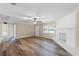 Open-concept living room features new flooring and a cozy fireplace at 1013 Glensprings Ave, Winter Garden, FL 34787