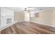 Spacious living room with updated floors, fireplace, and ample natural light at 1013 Glensprings Ave, Winter Garden, FL 34787