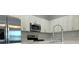 Modern kitchen featuring stainless steel appliances and bright white cabinetry at 16435 Sw 27Th Ave, Ocala, FL 34473
