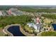 Overhead view of a community featuring a pool, clubhouse, and surrounding nature, perfect for Gathering fun at 17313 Bracken Fern Ln, Clermont, FL 34714