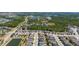 Aerial view of residential neighborhood with ponds, lakes, and natural landscapes nearby at 17313 Bracken Fern Ln, Clermont, FL 34714