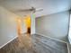 A well-lit bedroom features a ceiling fan and wood-look floors, creating a cozy and inviting space at 2608 Grassy Point Dr # 102, Lake Mary, FL 32746