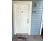 A welcoming front door, freshly painted and accented by a stylish light fixture for added curb appeal at 2608 Grassy Point Dr # 102, Lake Mary, FL 32746