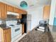 Well-equipped kitchen featuring stainless steel appliances, mosaic backsplash, and functional countertops at 2608 Grassy Point Dr # 102, Lake Mary, FL 32746