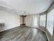 Spacious living room with stylish floors, a ceiling fan, and a glass door that provides ample natural light at 2608 Grassy Point Dr # 102, Lake Mary, FL 32746