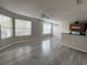Bright living room featuring durable flooring, abundant natural light and seamlessly flows into the kitchen at 2608 Grassy Point Dr # 102, Lake Mary, FL 32746