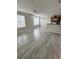 Open-concept living space featuring modern floors, lots of natural light, and a kitchen with modern appliances at 2608 Grassy Point Dr # 102, Lake Mary, FL 32746
