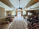 Spacious lounge area featuring high ceilings, a cozy fireplace, and ample seating for relaxation and socializing at 2608 Grassy Point Dr # 102, Lake Mary, FL 32746