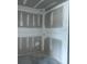 Unfinished corner showcasing newly installed drywall, ready for customization and final touches in the new home at 30151 Rustic Mill Street, Mount Dora, FL 32757