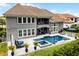 Stunning backyard featuring a pool, spa, patio with outdoor seating and a balcony at 3863 Grassland Loop, Lake Mary, FL 32746