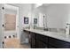 Well-lit bathroom featuring a vanity with granite countertop, framed mirror, and shower-tub combo at 3863 Grassland Loop, Lake Mary, FL 32746