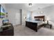 Cozy bedroom with plush carpet, neutral walls, large window, and a decorative headboard at 3863 Grassland Loop, Lake Mary, FL 32746