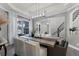 Elegant dining room with a modern chandelier and large window offering plenty of natural light at 3863 Grassland Loop, Lake Mary, FL 32746