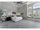 Spacious main bedroom boasting a tray ceiling, large windows, and cozy window seat at 3863 Grassland Loop, Lake Mary, FL 32746
