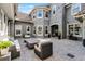 Back patio featuring comfortable outdoor seating and string lights for cozy evenings at 3863 Grassland Loop, Lake Mary, FL 32746