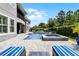 Beautiful backyard with pool, spa, sun loungers and manicured greenery providing privacy at 3863 Grassland Loop, Lake Mary, FL 32746