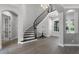 Beautiful staircase with iron railings and wood flooring, leading to the upper level at 3863 Grassland Loop, Lake Mary, FL 32746