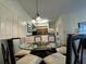 Modern dining room with glass table and contemporary chairs at 8125 Resort Village Dr # 51006, Orlando, FL 32821