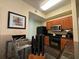 Well-equipped kitchen featuring black appliances, wood cabinetry and granite countertops at 8125 Resort Village Dr # 51006, Orlando, FL 32821