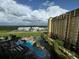 Beautiful condo view of a pirate ship pool and landscaping from this condo, perfect for vacation memories at 8125 Resort Village Dr # 51006, Orlando, FL 32821