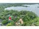 Aerial image highlighting the property's location near a lake and lush green surroundings at 1299 Harding Street, Winter Park, FL 32789