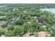 Bird's-eye perspective of the property within its neighborhood and mature trees at 1299 Harding Street, Winter Park, FL 32789