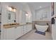 Modern bathroom featuring a soaking tub and and granite top vanities at 1299 Harding Street, Winter Park, FL 32789