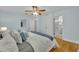 Comfortable bedroom with hardwood floors and view to a bathroom at 1299 Harding Street, Winter Park, FL 32789