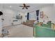 Bright Bedroom with a comfortable sofa, baby furniture, ceiling fan, and window shutters at 1299 Harding Street, Winter Park, FL 32789