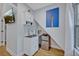 Small kitchenette featuring a sink, cabinet space, and mini fridge at 1299 Harding Street, Winter Park, FL 32789