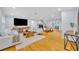 Spacious living room featuring hardwood floors, a modern fireplace, and comfortable seating, perfect for relaxation and entertaining at 1299 Harding Street, Winter Park, FL 32789