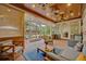 Covered patio with brick floors, comfortable seating, ceiling fans and outdoor view at 1299 Harding Street, Winter Park, FL 32789