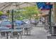 Charming downtown street view showcasing outdoor dining at Blu on the avenue and adjacent shops at 1299 Harding Street, Winter Park, FL 32789