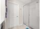 Clean bathroom featuring a glass-enclosed shower and a white door at 542 Patton Loop, Bartow, FL 33830