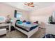 Bedroom with carpeting, a large window, ceiling fan, and a stylish vanity at 542 Patton Loop, Bartow, FL 33830