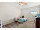 Bedroom featuring carpeting, natural light, and a ceiling fan at 542 Patton Loop, Bartow, FL 33830