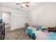 Bedroom featuring carpeting, neutral walls, and a spacious closet at 542 Patton Loop, Bartow, FL 33830