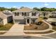 Charming two-story home featuring a well-maintained lawn, a classic facade, and an attached garage at 542 Patton Loop, Bartow, FL 33830