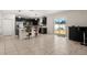 Open-concept kitchen with stainless steel appliances, a large island, and access to the backyard at 542 Patton Loop, Bartow, FL 33830
